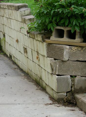 collapsing retaining wall with severe damage in Kawartha Lakes
