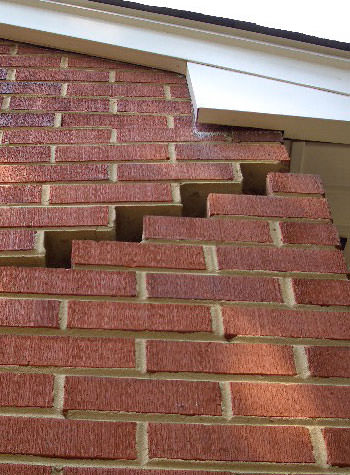 photo of a rotating foundation wall with cracks in Orillia