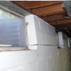 A foundation showing severe inward buckling along the windows in a Guelph home.