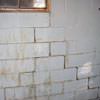 A cracked foundation wall near a window in a Aurora home