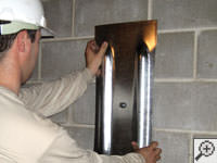 Mounting a foundation wall plate for an earth anchor installation in Barrie.