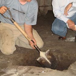 Digging a hole for the engineered fill used in a crawl space support system installation in Richmond Hill