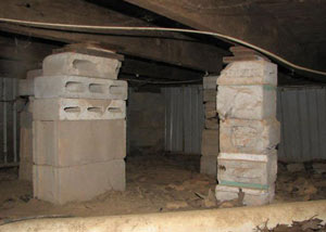 crawl space repairs done with concrete cinder blocks and wood shims in a Pickering home