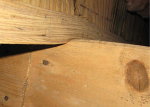 A failing girder showing signs of compression damage in a Whitchurch-Stouffville home