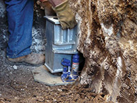 Securing a foundation footing bracket for a foundation repair system in St. Catharines.