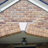 Major tuckpointing on a home archway over a door, with tuckpointing several inches wide that has failed on a Toronto home