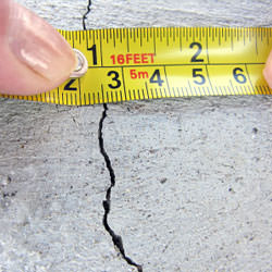 A crack in a poured concrete wall that's showing a normal crack during curing in Innisfil
