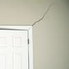 A long drywall crack beginning at the corner of a doorway in a Newmarket home.