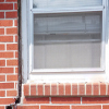 A gap in a window along the outer wall due to foundation settlement of a Whitby home.