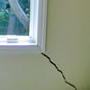 A long, diagonal crack that begins at a window corner of a Clarington home