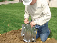 Fastening an earth anchor for a severely bowing wall in Oakville.