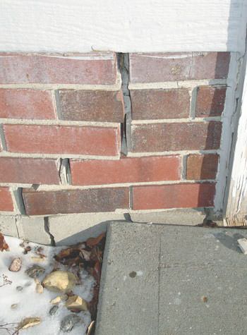 Severe street creep damage to a garage wall outside a New Tecumseth home