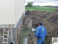 Drilling the hole in the foundation wall for street creep repairs in Caledon