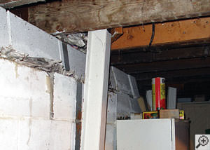 A failing foundation wall and i-beam support in a Toronto home